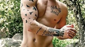 Tats And Uncut Cock